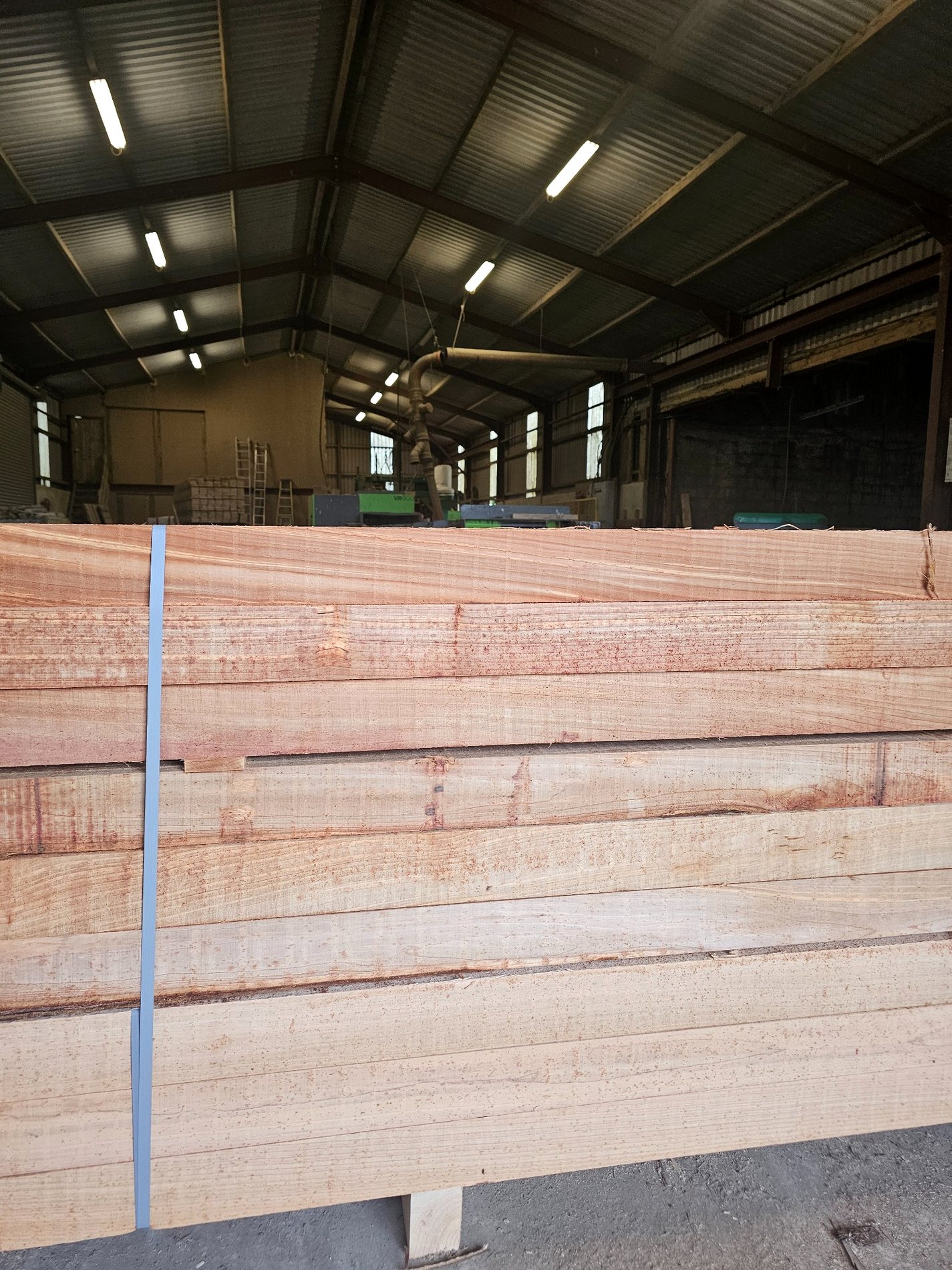 Freshly sawn timber bundles inside the sawmill