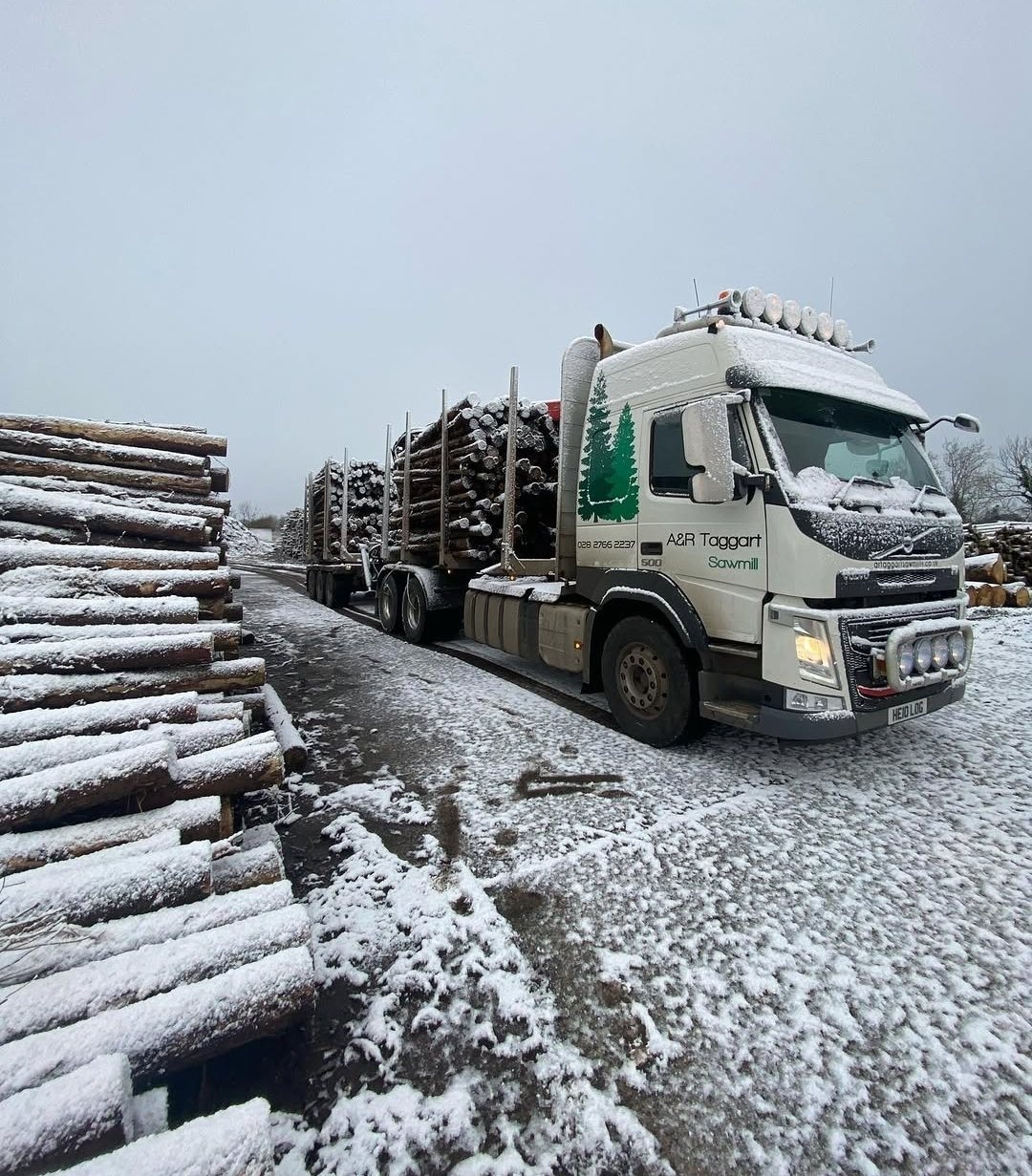 A&R Taggart lorry loaded with logs in snow